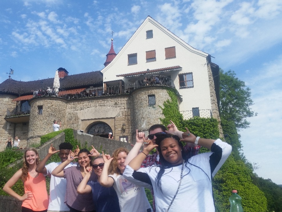 Student working on campus stairs