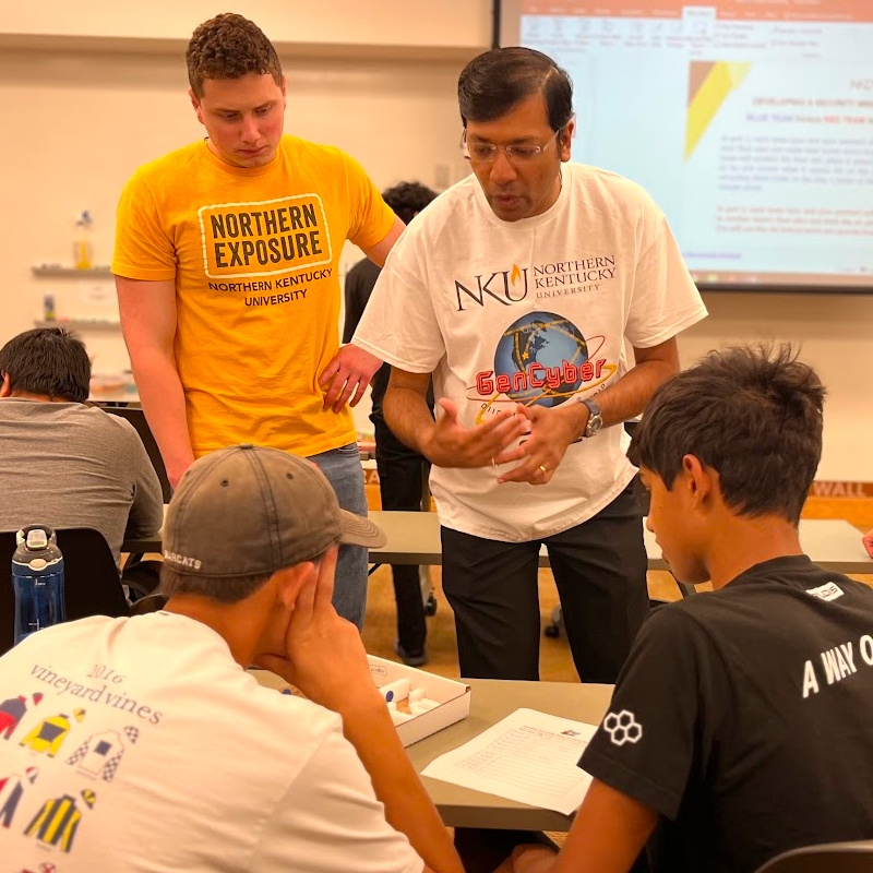 Academy students working on a cybersecurity project.