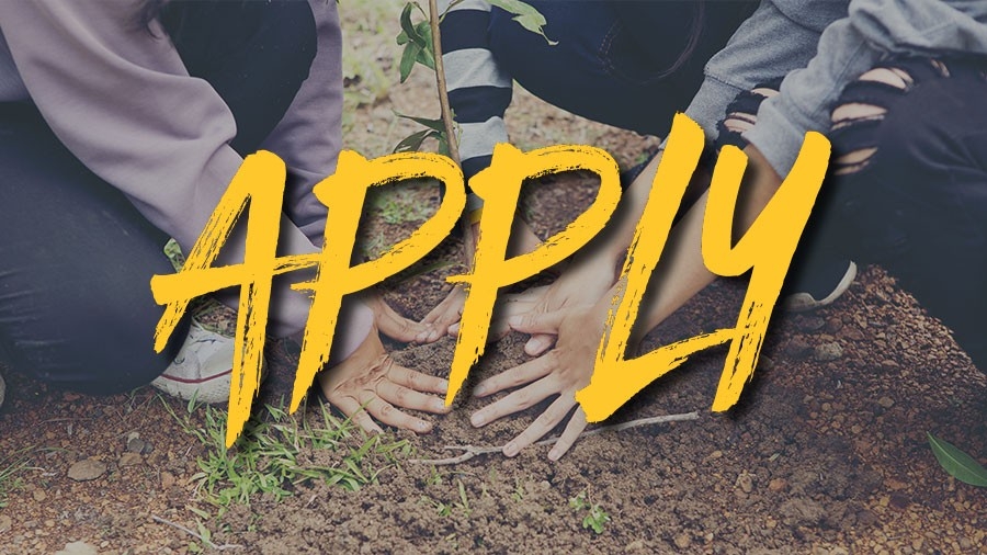 Volunteers planting trees - the word Act is superimposed